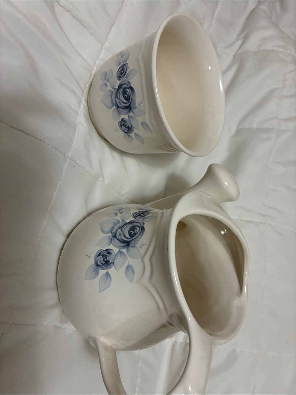 Pfaltzgraff  blue floral vase and watering pitcher.